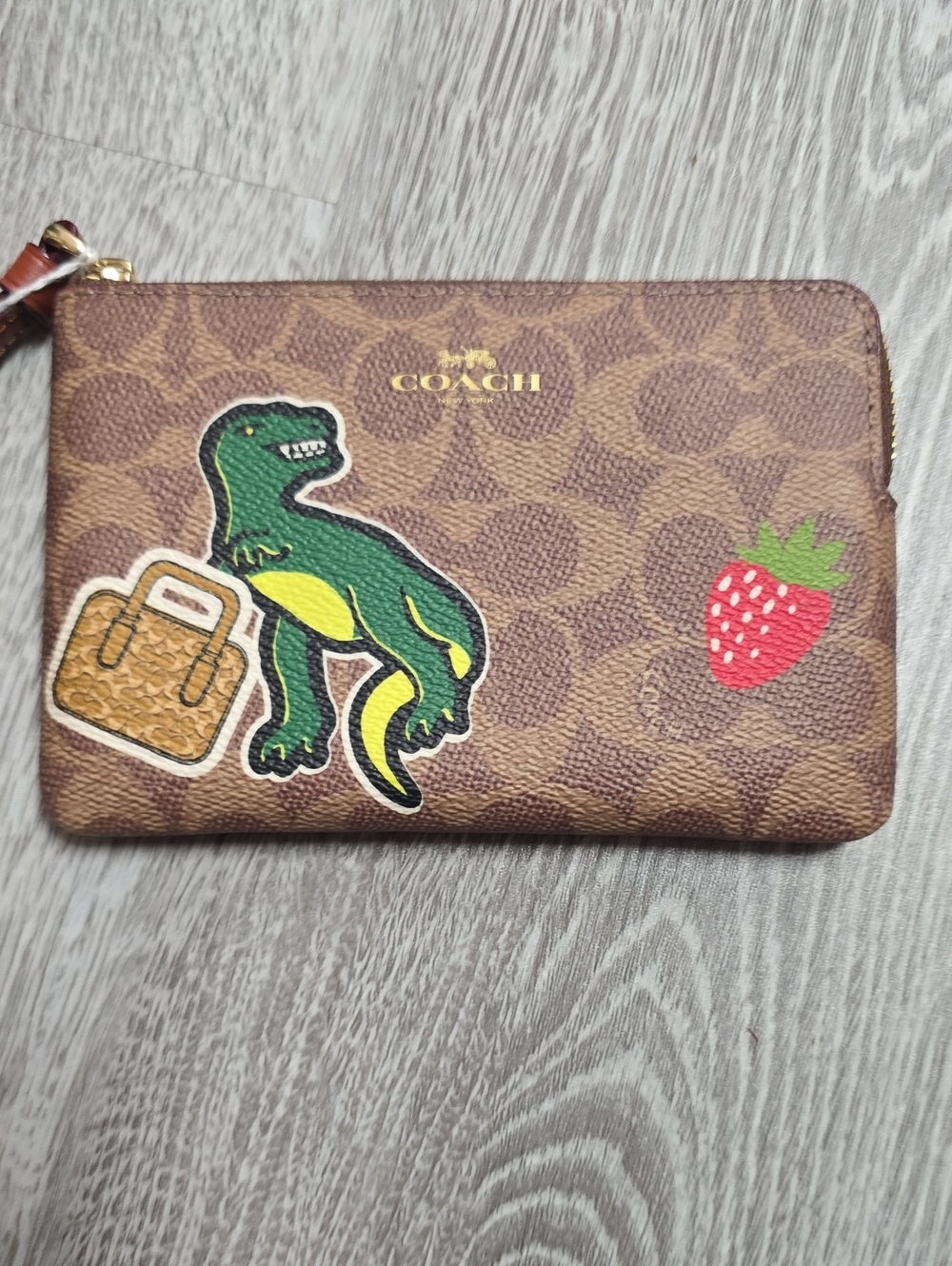 NWT Coach Brown Signature Wristlet with Green Dino & Red Strawberry